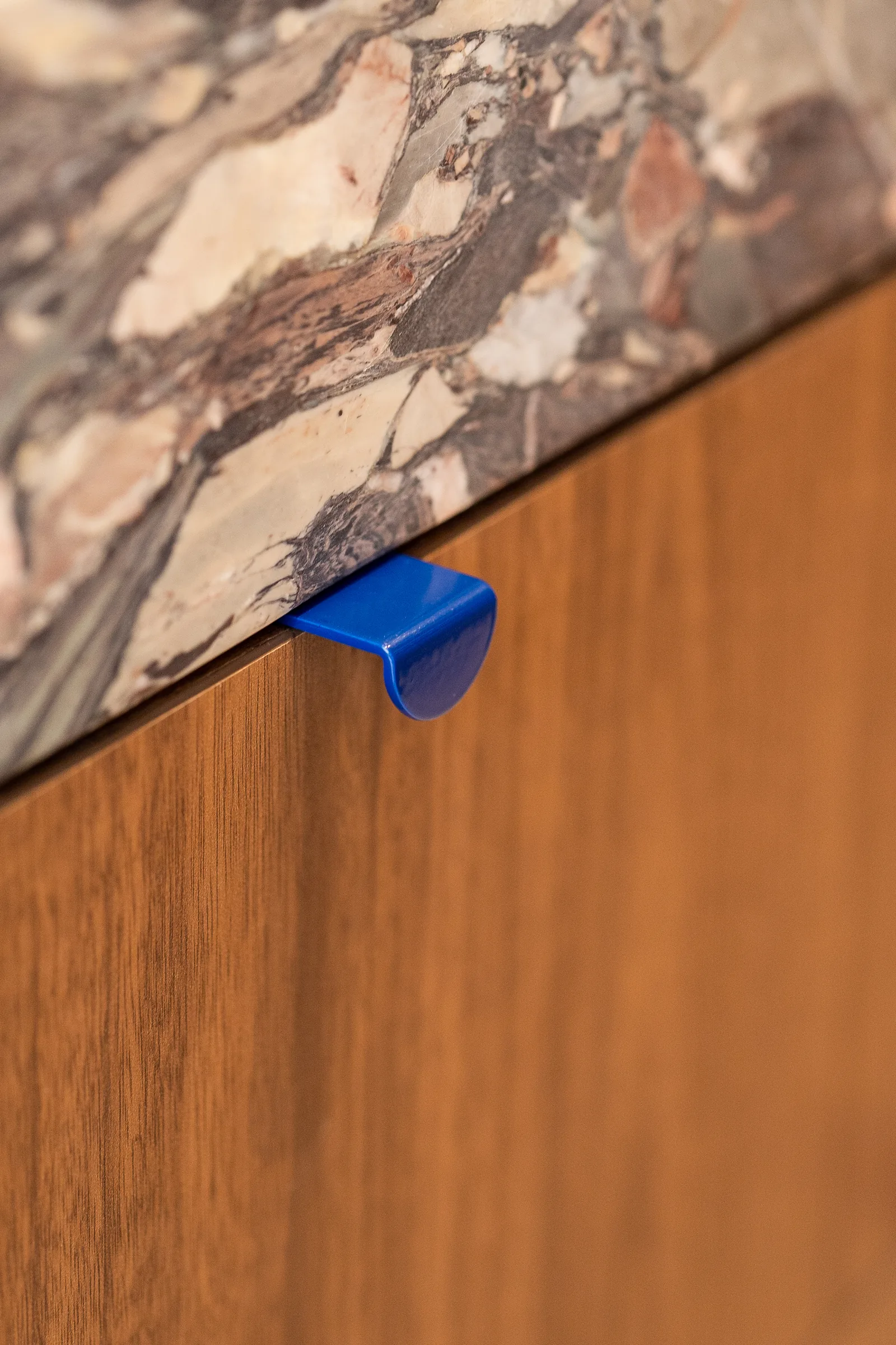 Blue powder-coated handle on walnut, Sayers Home